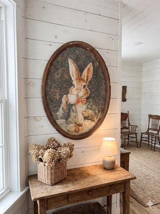 Oval Shaped Weathered Framed Bunny Sipping Tea